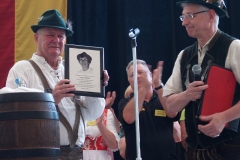 Ed Keller with a plaque remembering Sarah Keller