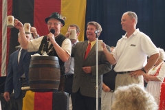 Mayor Tom Henry taps the first keg